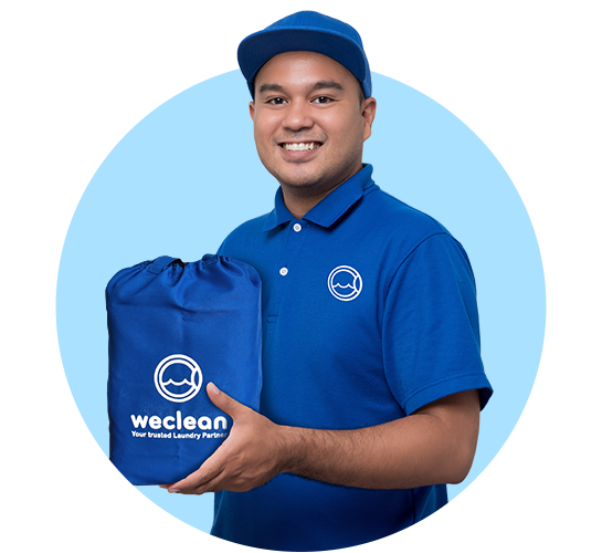 Laundry delivery man holding a Weclean laundry bag